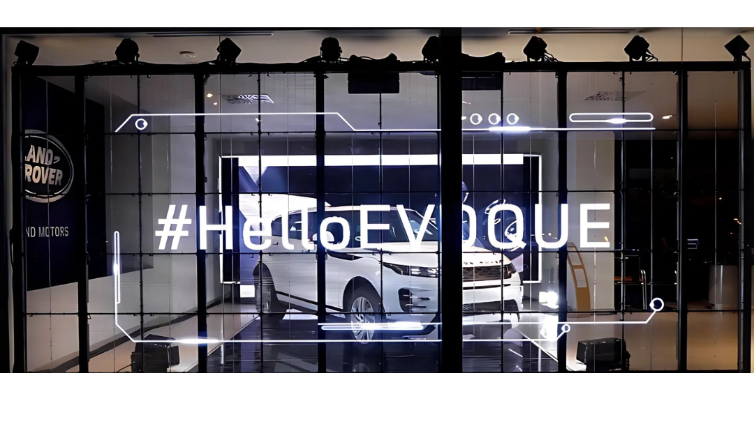 A large Transparent LED Film display with the words #HelloEVOQUE commemorating the release of the new Range Rover Evoque